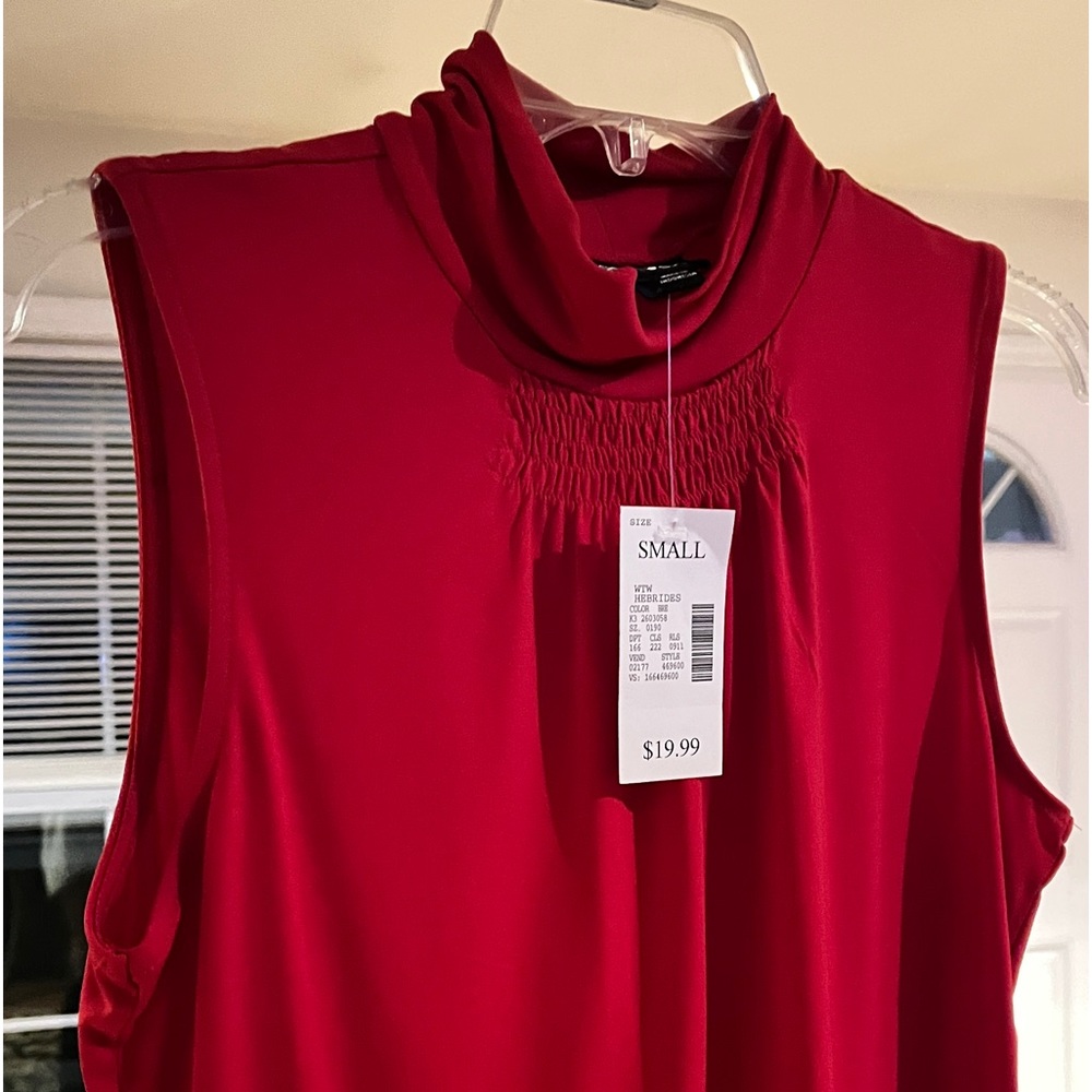 Red sleeveless blouse. Perfect for under a jacket or sweater.